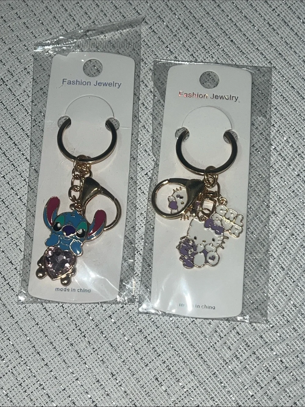 2 keychains. Lilo & Hello Kitty